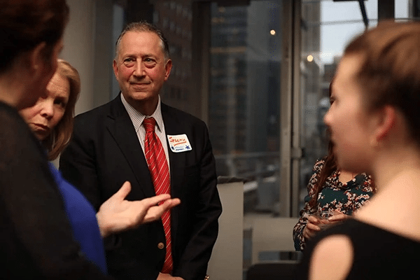 Dr. Jeremy Nobel speaks with attendees at an UnLonely event