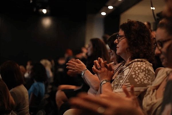 The audience claps at the UnLonely Film Festival